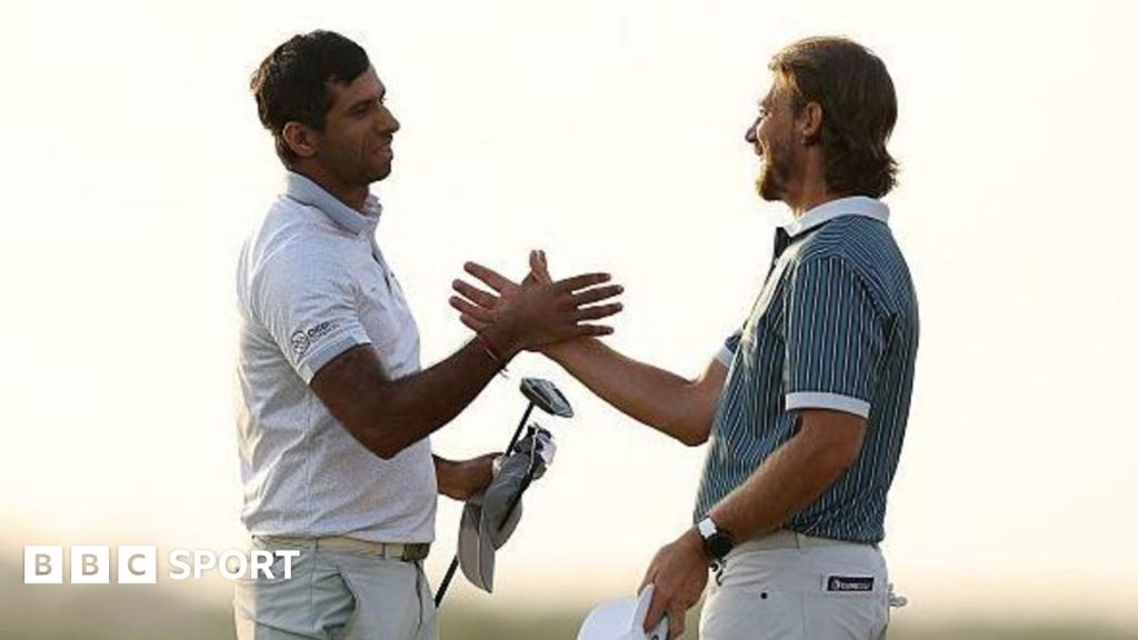 Abu Dhabi Championship: Aaron Rai beats Tommy Fleetwood in play-off Aaron Rai shaking hands with Tommy Fleetwood after his winning putt.