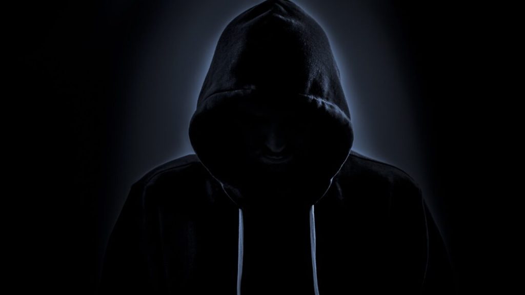 FBI orders domain registrar to reveal who runs mysterious Archive.is site A person in a hoodie with their face hidden