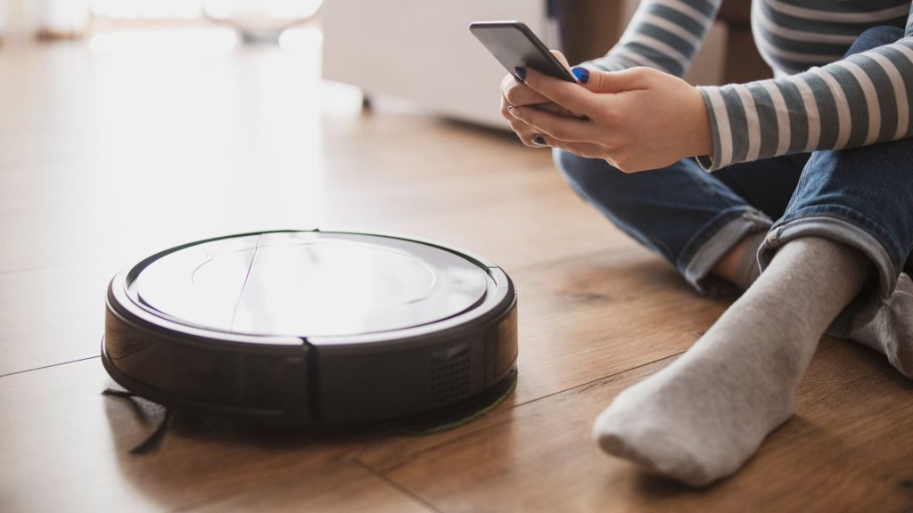 Manufacturer issues remote kill command to disable smart vacuum after engineer blocks it from collecting data — user revives it with custom hardware and Python scripts to run offline a smart vacuum being set up with a smart phone