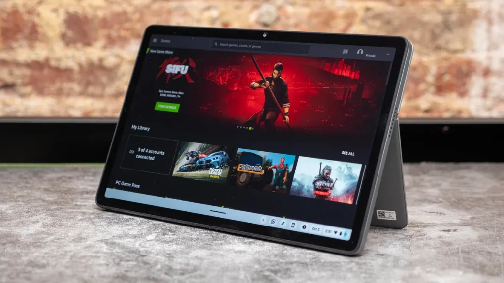 Lenovo Chromebook Duet 11 on a gray marbled table in front of a brick wall.